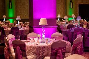 Dramatic Hot Pink and Green lighting with Pink and Ivory Linens for a Wedding at the Red Oak Ballroom B in Fort Worth, Sundance Square