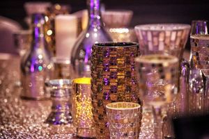 Elegant Gold, Silver and Copper Glass Decor with textured table linens for a Wedding Reception at the Red Oak Ballroom B in Fort Worth, Sundance Square