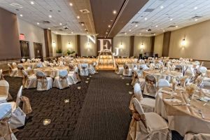 Gorgeous Gold and White Room set with Lighted Archway, Raised Head Table and Custom Gobo for a Wedding at the Red Oak Ballroom in Austin