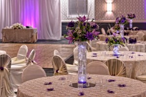 Beautiful Purple Centerpieces and full White linens at the Red Oak Ballroom B in San Antonio