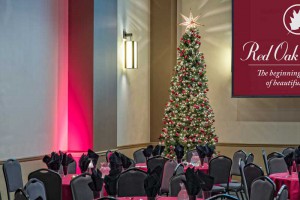 Holiday Party at Red Oak Ballroom Austin - set with standard red linens and tree for the Ballroom