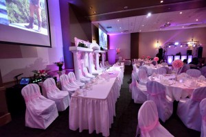 Quinceanera at the Red Oak Ballroom Austin, chair covers and ties, head table with columns