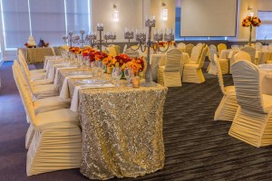 Elegant Wedding Reception Room Setup with covered guest chairs and specialty table linens at the Red Oak Ballroom in Houston, CityCentre