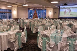 Elegant mint green and white Holiday Party set with chair covers, matching ties and table runners at Red Oak Ballroom Houston, CityCentre