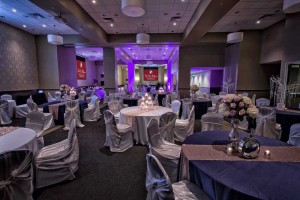Elegant White and Navy Blue linens Decor with textured table runners and Purple Uplighting for a Wedding Reception at the Red Oak Ballroom B in Fort Worth, Sundance Square