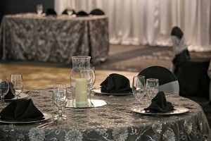 Stately Black and Gray table linens with plate chargers for a Special Celebration