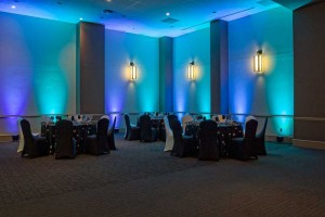 Striking Black and White Linens with Blue and Green Uplighting as a backdrop at the Red Oak Ballroom in Austin