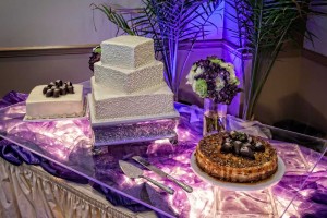 Wedding Cake Display with Purple Tooling and lighting for a Wedding at the Red Oak Ballroom in Austin