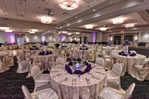 Beautiful Purple Centerpieces and full White linens at the Red Oak Ballroom B in San Antonio