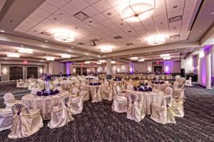 Beautiful Purple Centerpieces and full White linens at the Red Oak Ballroom B in San Antonio