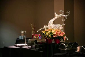 Fanciful Holiday Party buffet decorations on food table, including a carving station