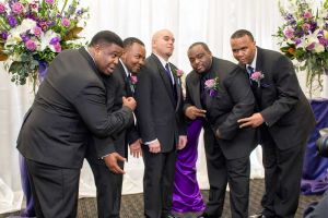 Groomsmen pose at the Red Oak Ballroom in Austin